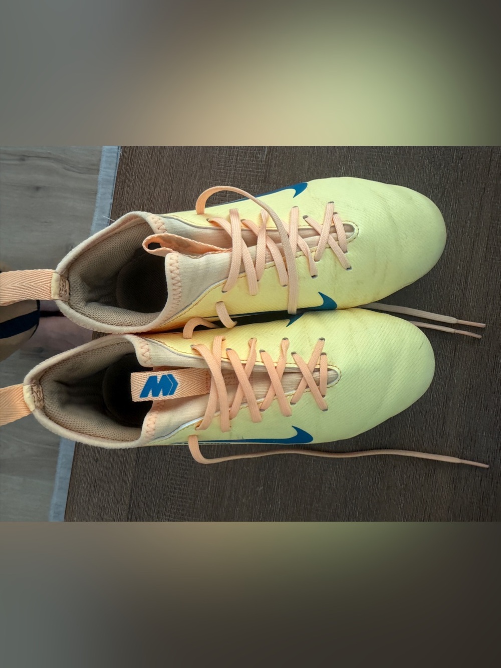 Nike Kids Unisex Yellow and Peach Cleats with Blue Swoosh- size 4